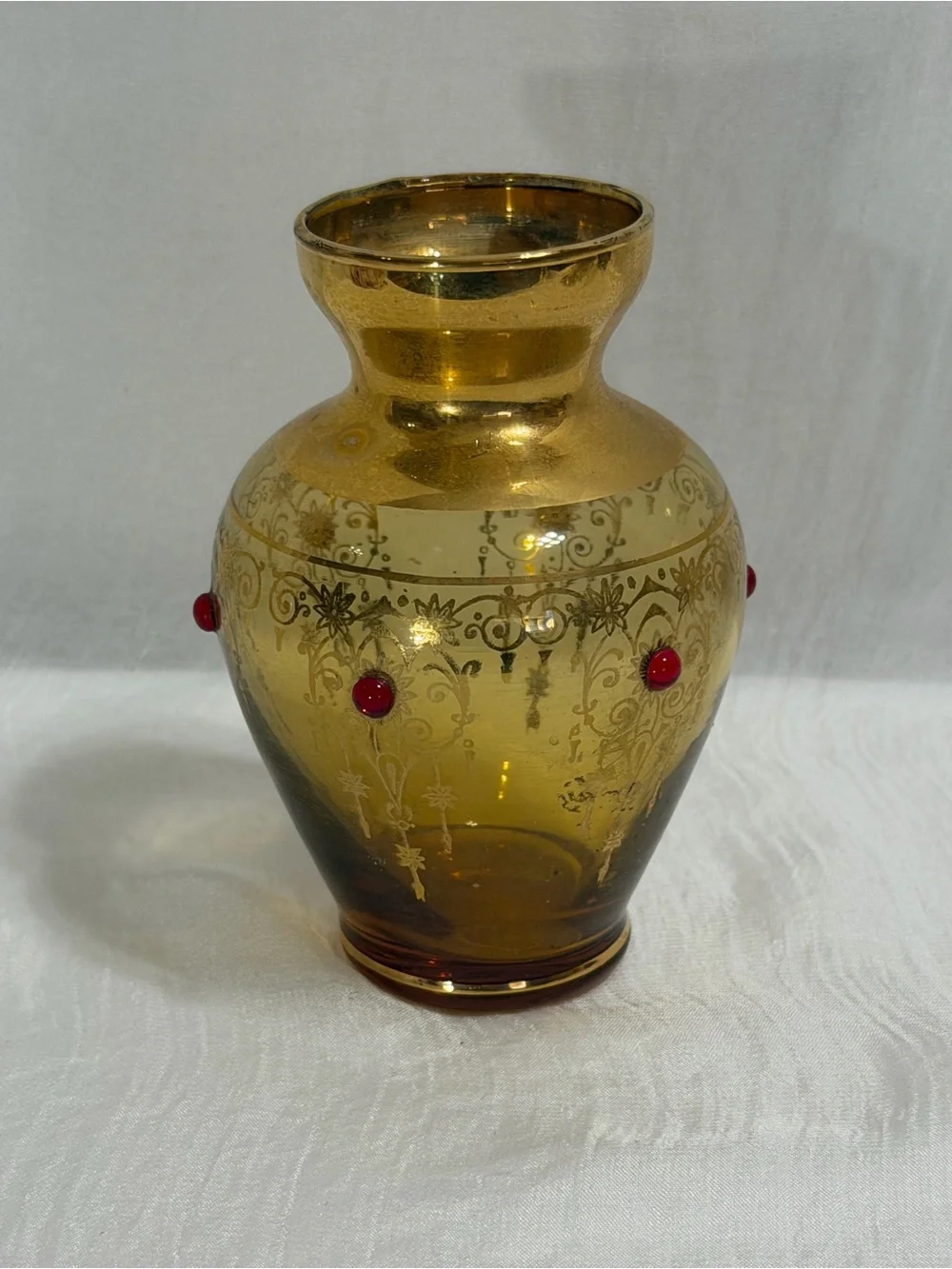 Vecchia Murano vintage amber glass vase with 24K gold trim and red cones.